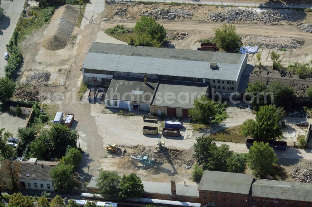 Aerial photograph Berlin - Industrial building on a company and industrial compound in the Biesdorf part of the district of Marzahn-Hellersdorf in Berlin in Germany. Construction works are taking place on the compound between Alt Biesdorf and Weissenhoeher Strasse streets