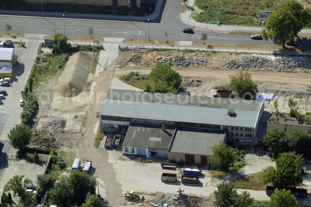 Berlin from the bird's eye view: Industrial building on a company and industrial compound in the Biesdorf part of the district of Marzahn-Hellersdorf in Berlin in Germany. Construction works are taking place on the compound between Alt Biesdorf and Weissenhoeher Strasse streets