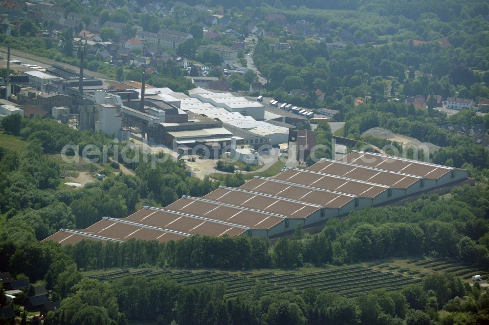 Aerial image Obernkirchen - Industrial compound and production site of Ardagh Glass in Obernkirchen in the state of Lower Saxony. The large site with different buildings, halls and the large distinct hall with red-brown roof is the site of two Ardagh Glass companies that produce for the international glass industry: Heye International and Schaumburger Formenbau GmbH