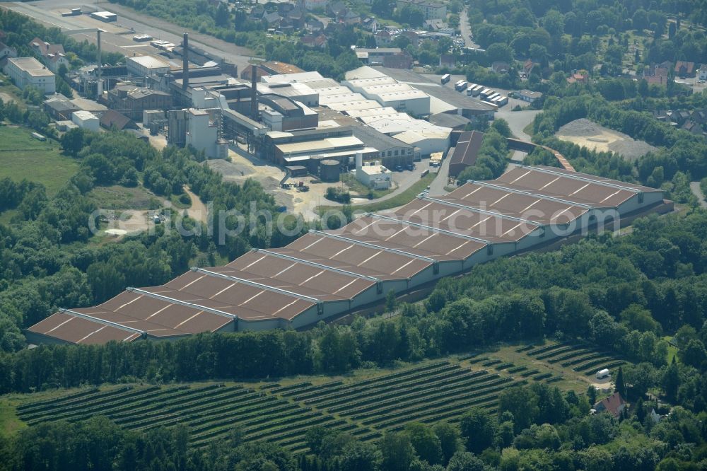 Aerial photograph Obernkirchen - Industrial compound and production site of Ardagh Glass in Obernkirchen in the state of Lower Saxony. The large site with different buildings, halls and the large distinct hall with red-brown roof is the site of two Ardagh Glass companies that produce for the international glass industry: Heye International and Schaumburger Formenbau GmbH