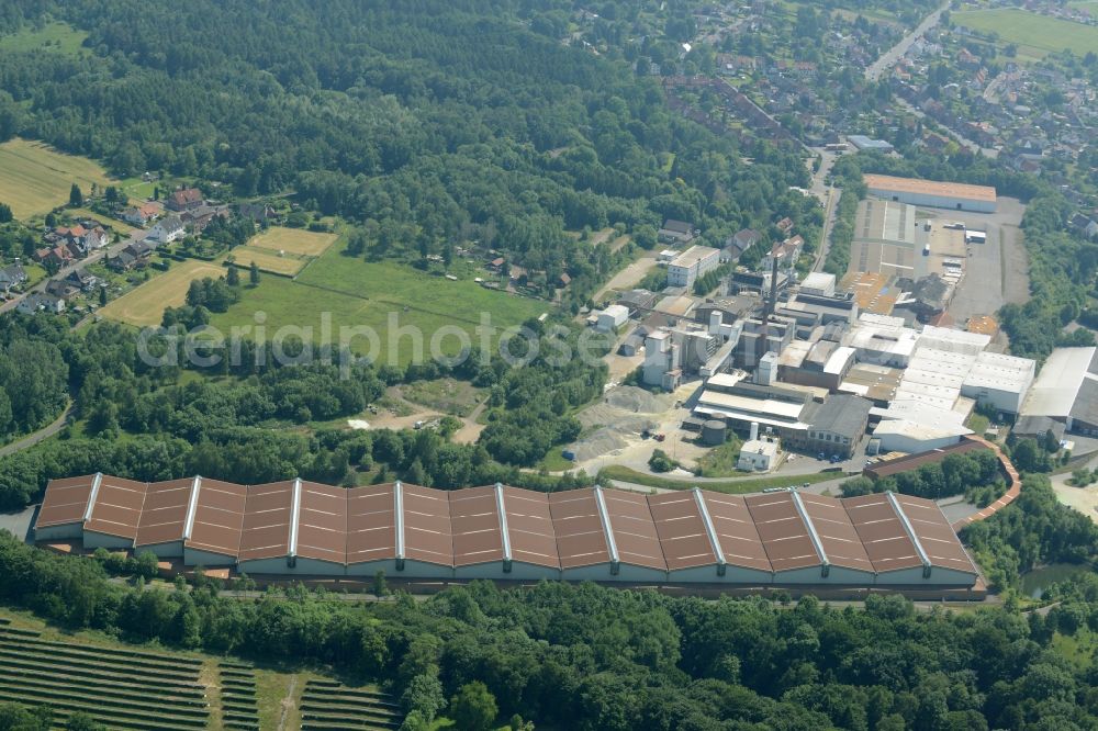 Aerial image Obernkirchen - Industrial compound and production site of Ardagh Glass in Obernkirchen in the state of Lower Saxony. The large site with different buildings, halls and the large distinct hall with red-brown roof is the site of two Ardagh Glass companies that produce for the international glass industry: Heye International and Schaumburger Formenbau GmbH