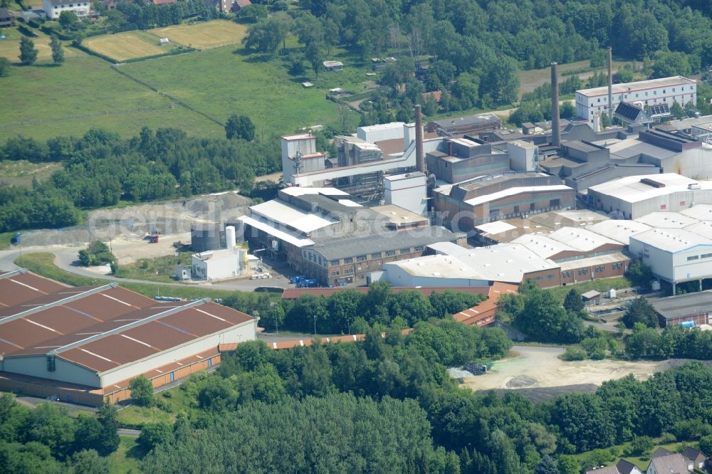 Aerial image Obernkirchen - Industrial compound and production site of Ardagh Glass in Obernkirchen in the state of Lower Saxony. The large site with different buildings, halls and the large distinct hall with red-brown roof is the site of two Ardagh Glass companies that produce for the international glass industry: Heye International and Schaumburger Formenbau GmbH