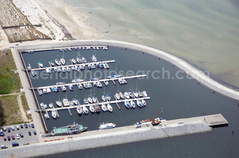 Aerial photograph Lubmin - Blick auf den Industriehafen Lubmin nahe dem stillgelegtem Kernkraftwerk / KKW VEB Brunno Leuschner, nach der Wende Kernkraftwerk Greifswald / KGR. Zur Industrieansiedlung wurde der ehemalige Kühlwasserauslaufkanal des KKW mit öffentlichen Mitteln zu einem Hafen ausgebaut. Zusätzlich soll ein Gasturbinenkraftwerk errichtet werden, das den Standort attraktiv für energieintensive Industrie (Holz, Papier, Metall) machen soll. Heute erfolgt der Rückbau des KKW durch die Energiewerke Nord GmbH, Latzower Staße 1, 17509 Rubenow, Tel. +49(0)38354 40, Fax: +49(0)38354 22458, e-mal: poststelle@ewn-gmbh.de