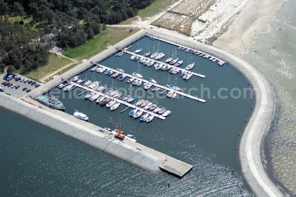 Aerial photograph Lubmin - Blick auf den Industriehafen Lubmin nahe dem stillgelegtem Kernkraftwerk / KKW VEB Brunno Leuschner, nach der Wende Kernkraftwerk Greifswald / KGR. Zur Industrieansiedlung wurde der ehemalige Kühlwasserauslaufkanal des KKW mit öffentlichen Mitteln zu einem Hafen ausgebaut. Zusätzlich soll ein Gasturbinenkraftwerk errichtet werden, das den Standort attraktiv für energieintensive Industrie (Holz, Papier, Metall) machen soll. Heute erfolgt der Rückbau des KKW durch die Energiewerke Nord GmbH, Latzower Staße 1, 17509 Rubenow, Tel. +49(0)38354 40, Fax: +49(0)38354 22458, e-mal: poststelle@ewn-gmbh.de