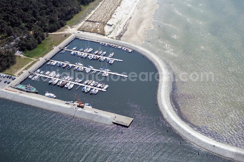 Lubmin from the bird's eye view: Blick auf den Industriehafen Lubmin nahe dem stillgelegtem Kernkraftwerk / KKW VEB Brunno Leuschner, nach der Wende Kernkraftwerk Greifswald / KGR. Zur Industrieansiedlung wurde der ehemalige Kühlwasserauslaufkanal des KKW mit öffentlichen Mitteln zu einem Hafen ausgebaut. Zusätzlich soll ein Gasturbinenkraftwerk errichtet werden, das den Standort attraktiv für energieintensive Industrie (Holz, Papier, Metall) machen soll. Heute erfolgt der Rückbau des KKW durch die Energiewerke Nord GmbH, Latzower Staße 1, 17509 Rubenow, Tel. +49(0)38354 40, Fax: +49(0)38354 22458, e-mal: poststelle@ewn-gmbh.de