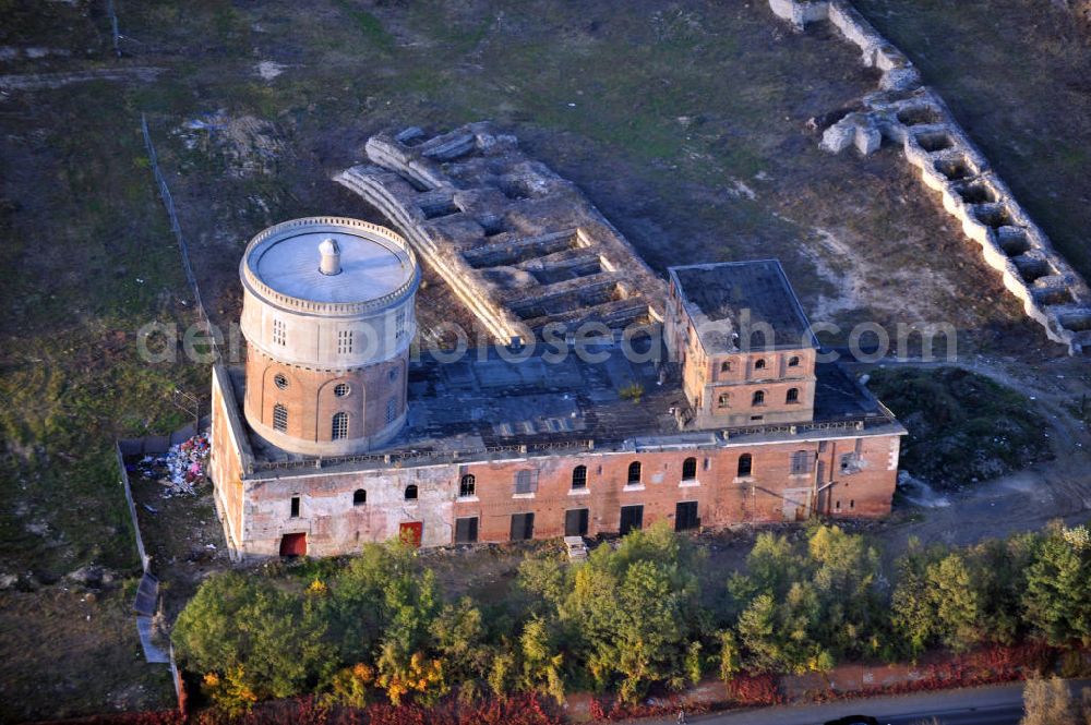 Aerial photograph Ingolstadt - Die Geschützstellung, der Kavalier Dallwigk, mit dem Wasserturm sind Denkmäler des Industriezeitalters in Ingolstadt. Beide sind Ruinen der Ingolstädter Festungsanlagen auf dem Gelände der Alten Gießerei der Schubert & Salzer Maschinenfabrik AG. Die Gebäude werden in Vorbereitung des Umbaus zum Museum für konkrete Kunst und Design von der Morpho-Logic Architektur und Stadtplanung restauriert und saniert. Parts of the Ingolstadt fortification ruins Kavalier Dallwigk with its water tower which are monuments of Ingolstadts Industrial Age.