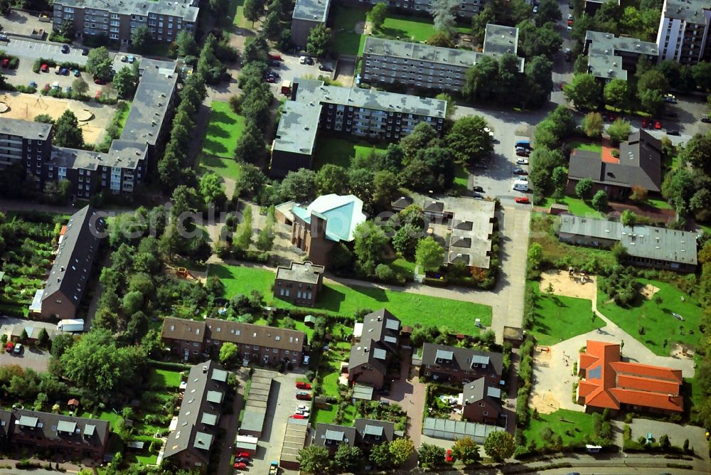 Aerial image Mohnheim - Downtown at the Protestant church in residential area Brandenburg Avenue in Monheim in the state of North Rhine-Westphalia