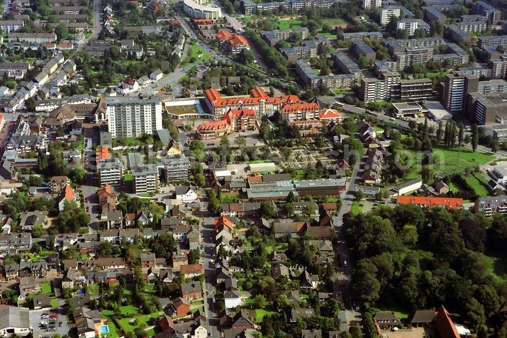 Aerial photograph Mohnheim - Downtown on the pedestrian area of ??the town hall center with urbane cemetery in Monheim in the state of North Rhine-Westphalia