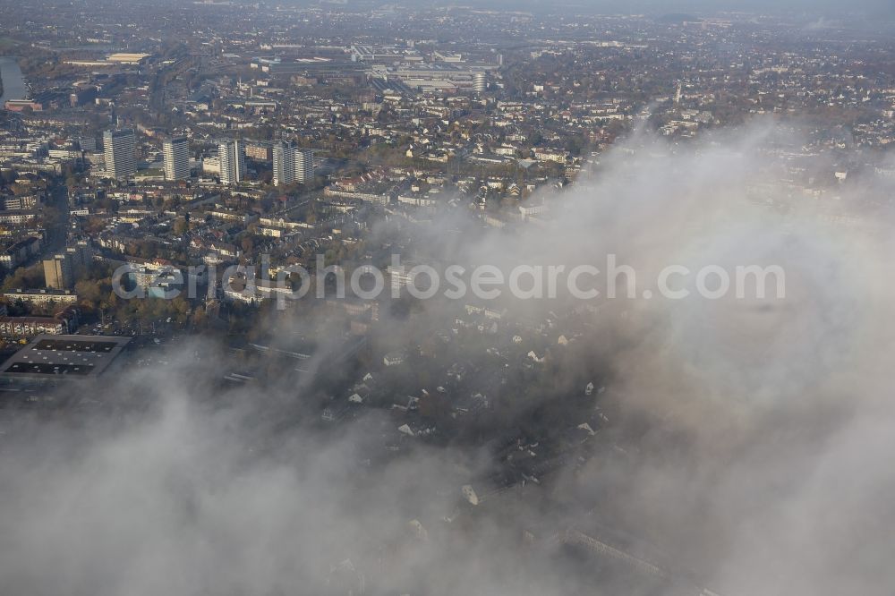 Aerial photograph Mülheim an der Ruhr - Inner city with the four residential towers behind deep autumnal clouds at Muelheim an der Ruhr in the Ruhr area in North Rhine-Westphalia