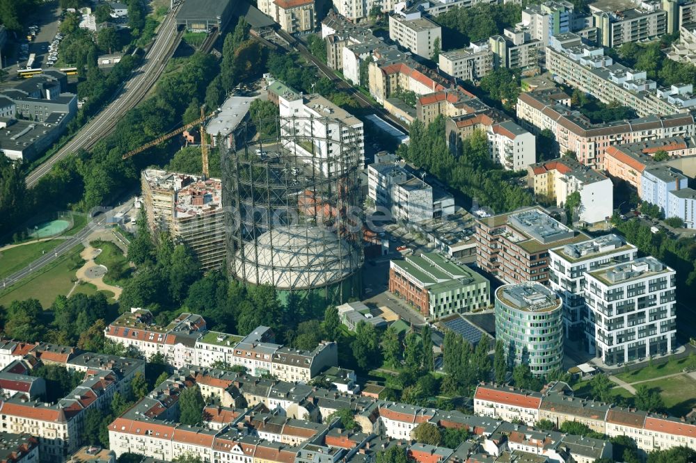 Aerial image Berlin - Innenstadtbereich am Gasometer and construction site for the construction of a multi-family house residential complex in the district of Tempelhof-Schoeneberg in Berlin, Germany