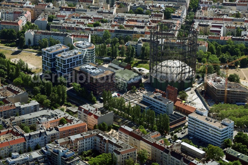 Aerial image Berlin - Innenstadtbereich am Gasometer and construction site for the construction of a multi-family house residential complex in the district of Tempelhof-Schoeneberg in Berlin, Germany