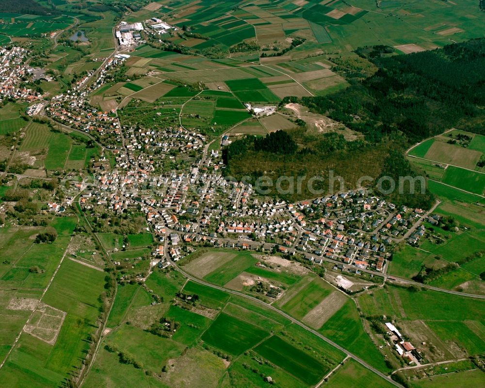 Daubringen from above - City view from the downtown area with the outskirts with adjacent agricultural fields in Daubringen in the state Hesse, Germany