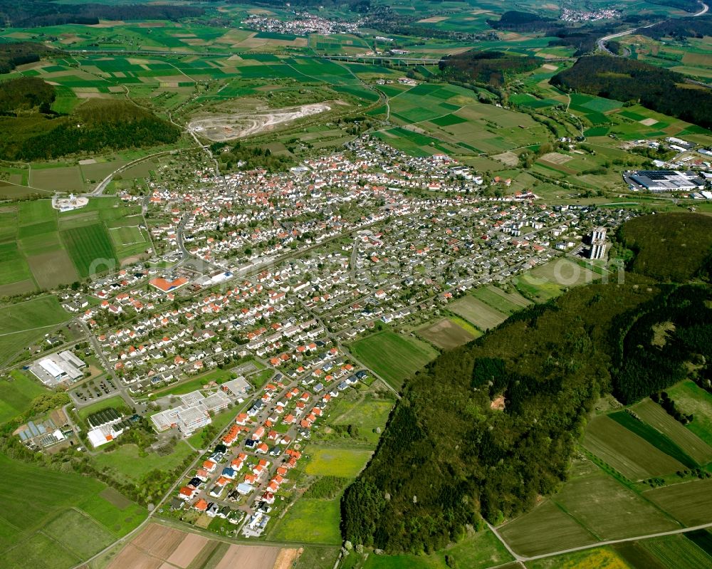 Großen-Buseck from the bird's eye view: City view from the downtown area with the outskirts with adjacent agricultural fields in Großen-Buseck in the state Hesse, Germany