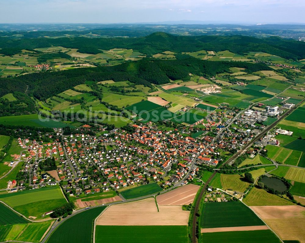 Heinebach from the bird's eye view: City view from the downtown area with the outskirts with adjacent agricultural fields in Heinebach in the state Hesse, Germany