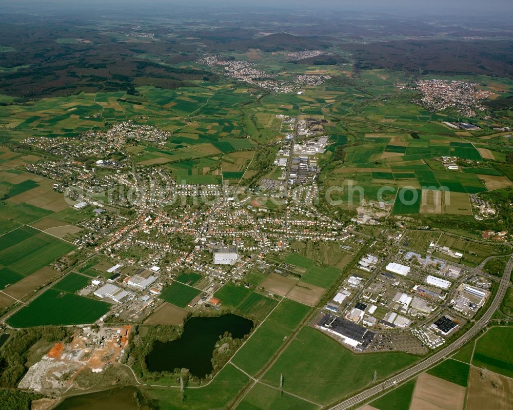 Heuchelheim from above - City view from the downtown area with the outskirts with adjacent agricultural fields in Heuchelheim in the state Hesse, Germany