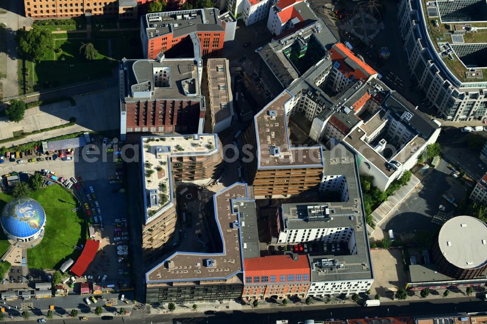 Berlin from the bird's eye view: Construction site to build a new multi-family residential complex Charlie Livin of Trockland Management GmbH along the Zimmerstrasse and Mauerstrasse in the district Mitte in Berlin, Germany