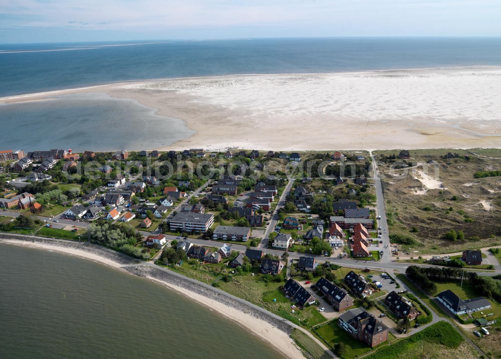 Aerial photograph Amrum - Blick auf die Insel Amrum, einer nordfriesischen Insel im Nationalpark Schleswig-Holsteinisches Wattenmeer in Nordfriesland in Schleswig-Holstein. Amrum ist die zehntgrößte Insel Deutschlands und gehört zu den drei nordfriesischen Geestkerninseln. Charakteristisch für die Insel ist der westlich angelagerten Kniepsand und dem kleinen westlich vorgelagerten Jungnamensand. Die fünf Orte der Insel liegen überwiegend im Osten der Insel – von Nord nach Süd – Norddorf auf Amrum, Nebel, Süddorf, Steenodde und Wittdün auf Amrum. Amrum, the third largest German island in North Friesland in Schleswig-Holstein.