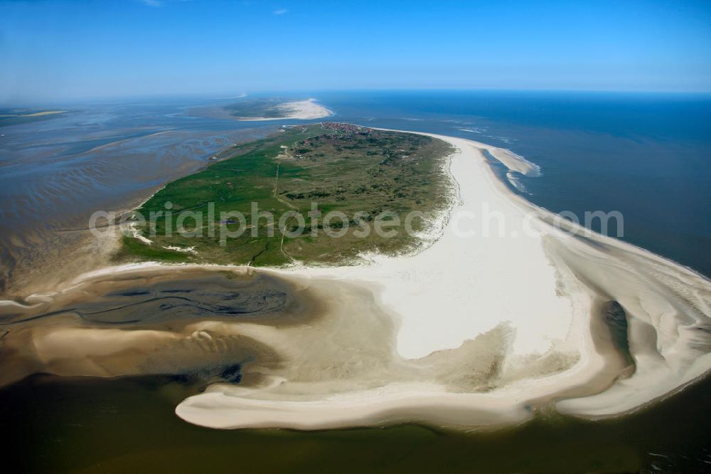 Aerial image Baltrum - Baltrum is a barrier island off the coast of East Frisia, in Germany, and is a municipality in the district of Aurich, Lower Saxony. It is located in-between the chain of the seven inhabited East Frisian Islands. Baltrum is the smallest island in this chain by area and inhabitants