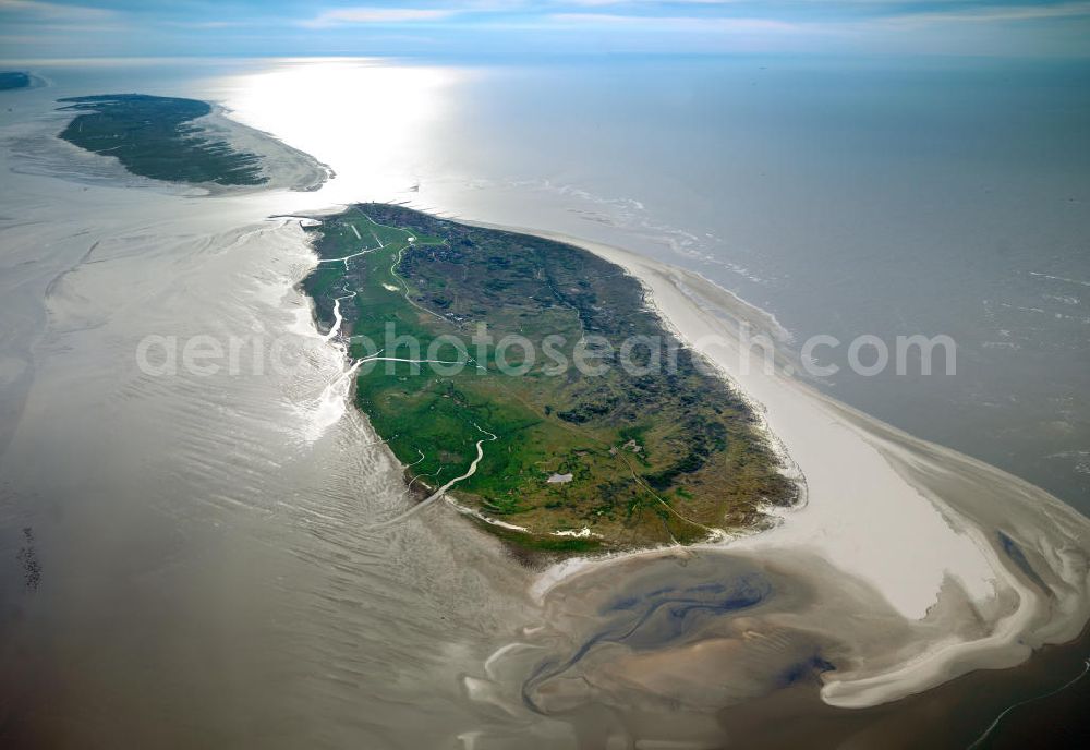 Baltrum from the bird's eye view: Baltrum is a barrier island off the coast of East Frisia, in Germany, and is a municipality in the district of Aurich, Lower Saxony. It is located in-between the chain of the seven inhabited East Frisian Islands. Baltrum is the smallest island in this chain by area and inhabitants