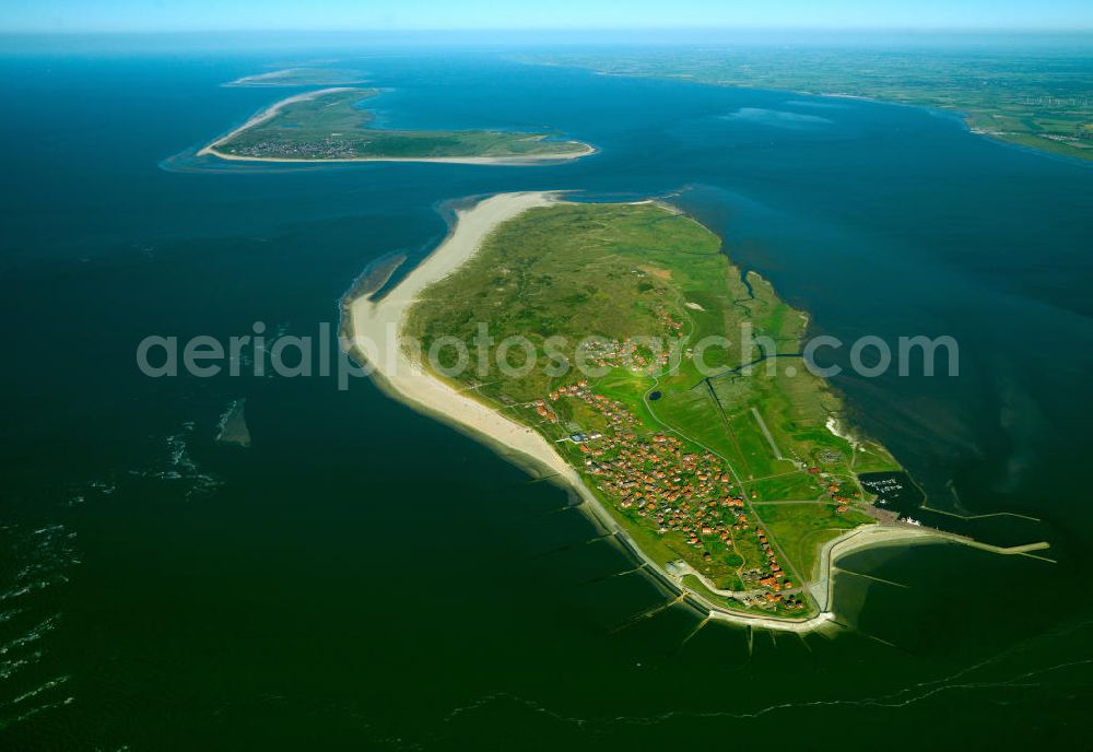 Baltrum from the bird's eye view: Baltrum is a barrier island off the coast of East Frisia, in Germany, and is a municipality in the district of Aurich, Lower Saxony. It is located in-between the chain of the seven inhabited East Frisian Islands. Baltrum is the smallest island in this chain by area and inhabitants