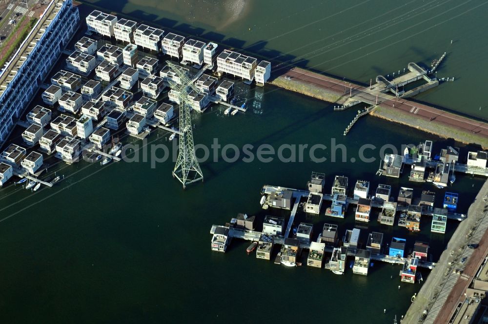 Amsterdam from the bird's eye view: View of the floating houses on the island Steigerwald in Amsterdam in the province of North Holland in the Netherlands. Steigerwald is one of seven artificial islands of the district IJburg