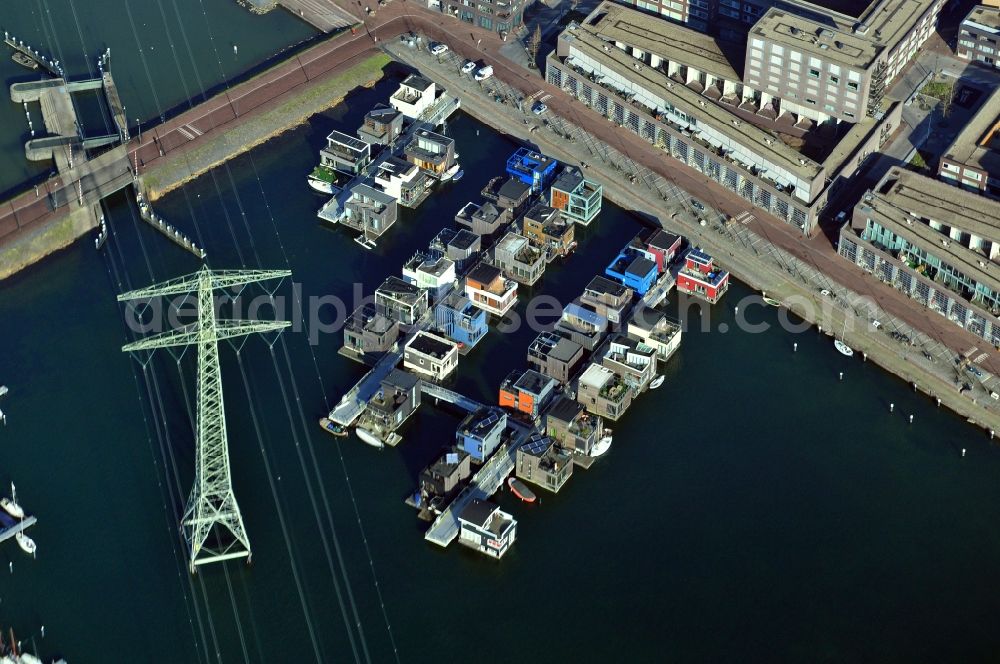 Aerial image Amsterdam - View of the floating houses on the island Steigerwald in Amsterdam in the province of North Holland in the Netherlands. Steigerwald is one of seven artificial islands of the district IJburg