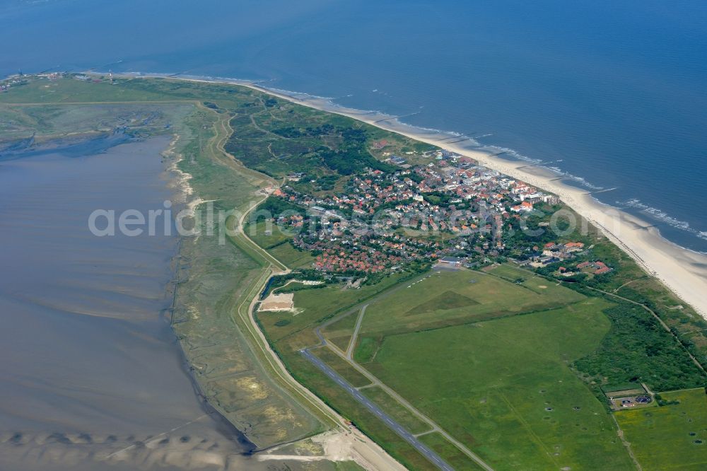 Aerial image Wangerooge - Wangerooge Island with the main town and airfield in the Wadden Sea of the North Sea in the state of Lower Saxony. Wangerooge is the Eastern-most inhabited of the East Frisian Islands. It has a sand beach and is a spa resort. View from the East of the main town, island and airfield