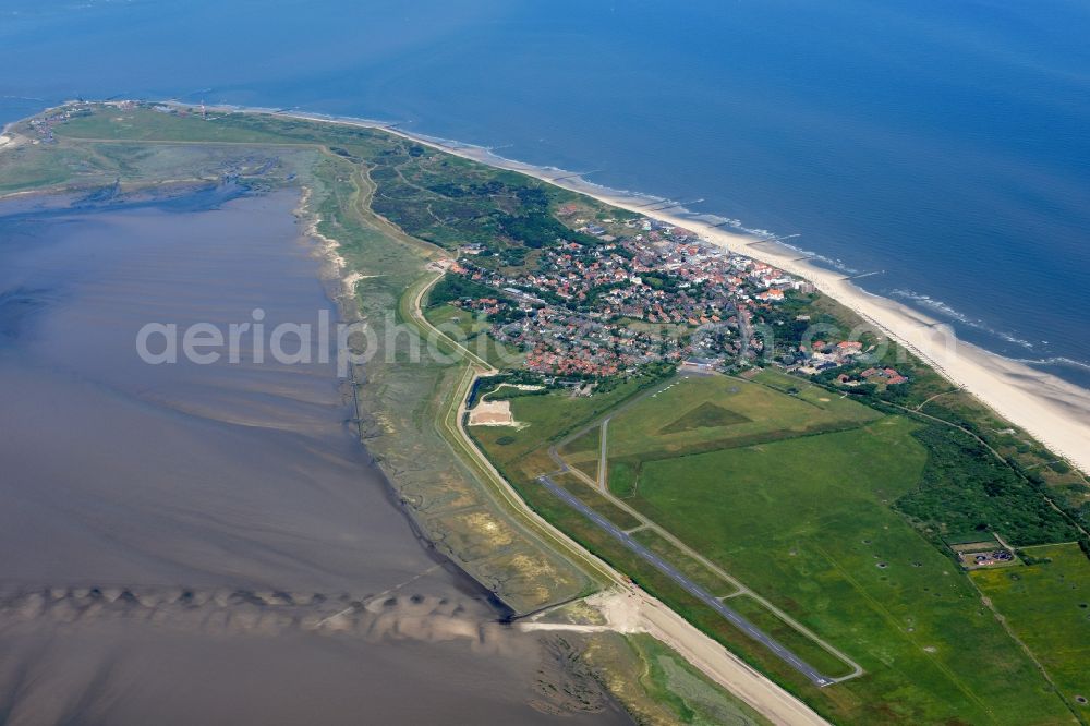 Wangerooge from above - Wangerooge Island with the main town and airfield in the Wadden Sea of the North Sea in the state of Lower Saxony. Wangerooge is the Eastern-most inhabited of the East Frisian Islands. It has a sand beach and is a spa resort. View from the East of the main town, island and airfield