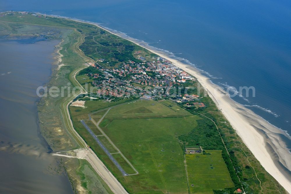 Wangerooge from the bird's eye view: Wangerooge Island with the main town and airfield in the Wadden Sea of the North Sea in the state of Lower Saxony. Wangerooge is the Eastern-most inhabited of the East Frisian Islands. It has a sand beach and is a spa resort. View from the East of the main town, island and airfield