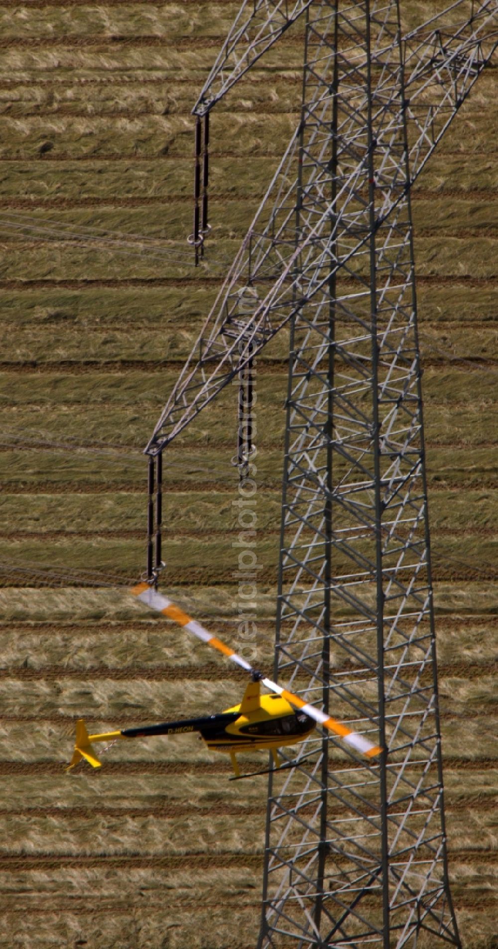 Aerial photograph Drensteinfurt - Inspection of poles and power lines of a utility by a helicopter flying low at Drensteinfurt in North Rhine-Westphalia