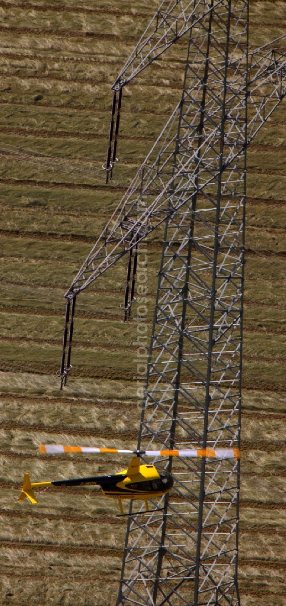 Drensteinfurt from above - Inspection of poles and power lines of a utility by a helicopter flying low at Drensteinfurt in North Rhine-Westphalia