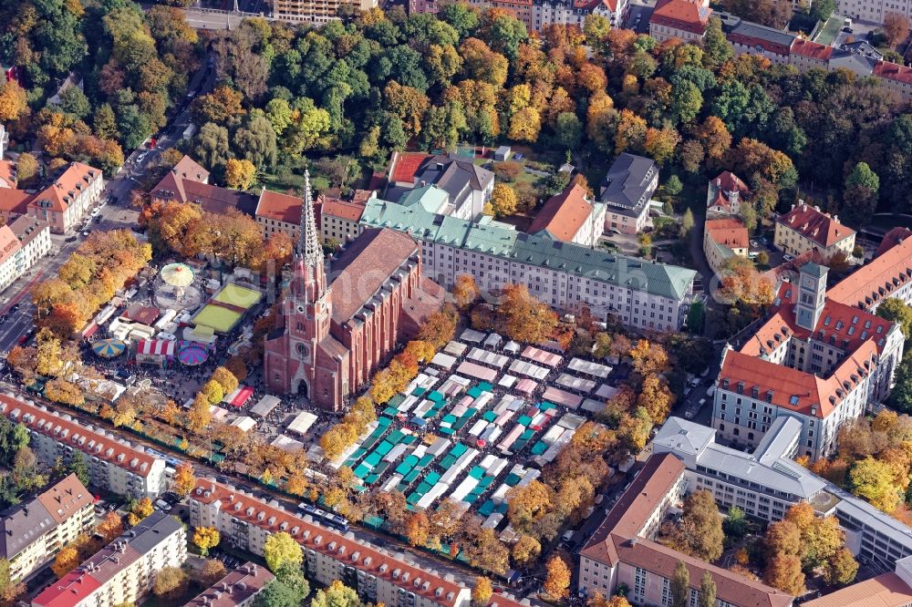 Aerial photograph München - Event facilities at the Volksfest Auer Dult on the Mariahilfplatz at the Mariahilf church in the city district of Au in Munich, Bavaria. The Herbstdult is also called Kirchweihdult