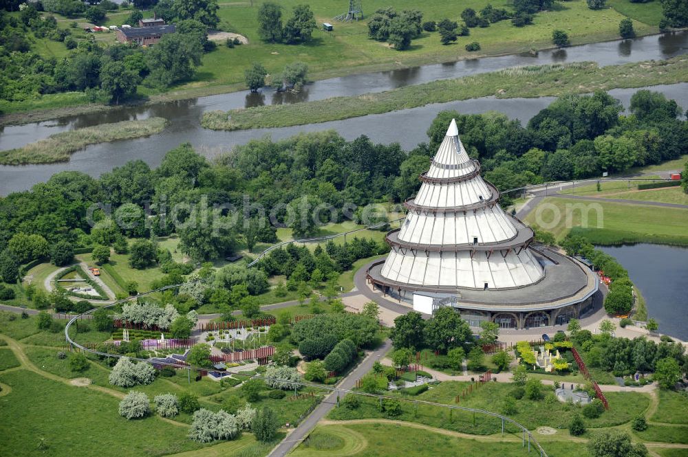 Magdeburg from above - Blick auf den Jahrtausendturm im Elbauenpark, auch als die BUGA - Pyramide bekannt. Der Jahrtausendturm in Magdeburg ist mit 60 Metern Höhe das höchste Holzgebäude Deutschlands und wurde anlässlich der Bundesgartenschau 1999 errichtet. Betreiber ist die Messe- und Veranstaltungsgesellschaft Magdeburg GmbH. View of the Millennium Tower in Elbauenpark. The Millennium Tower in Magdeburg is 60 meters is the tallest wooden building in Germany and was built at the Federal Garden Show 1999th