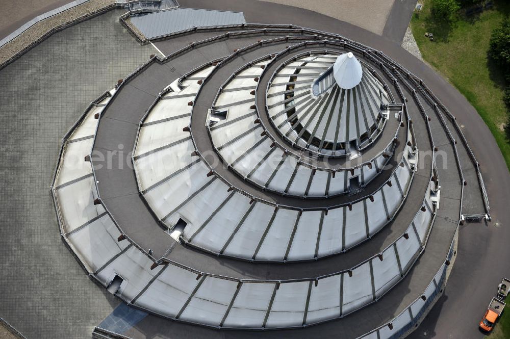 Aerial photograph Magdeburg - Blick auf den Jahrtausendturm im Elbauenpark, auch als die BUGA - Pyramide bekannt. Der Jahrtausendturm in Magdeburg ist mit 60 Metern Höhe das höchste Holzgebäude Deutschlands und wurde anlässlich der Bundesgartenschau 1999 errichtet. Betreiber ist die Messe- und Veranstaltungsgesellschaft Magdeburg GmbH. View of the Millennium Tower in Elbauenpark. The Millennium Tower in Magdeburg is 60 meters is the tallest wooden building in Germany and was built at the Federal Garden Show 1999th