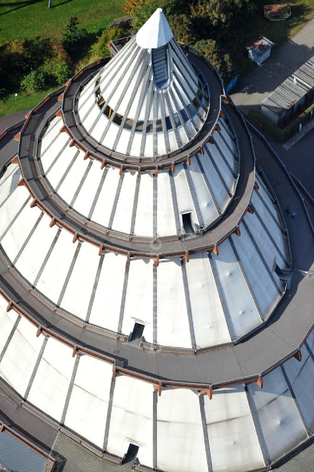 Magdeburg from the bird's eye view: Der Jahrtausendturm im Elbauenpark in Sachsen-Anhalt, ist auch als die BUGA - Pyramide bekannt. Der Jahrtausendturm in Magdeburg ist mit 60 Metern Höhe das höchste Holzgebäude Deutschlands. Betreiber ist die Messe- und Veranstaltungsgesellschaft Magdeburg GmbH. View of the Millennium Tower in Elbauenpark. The Millennium Tower in Magdeburg is 60 meters and it is the tallest wooden building in Germany.