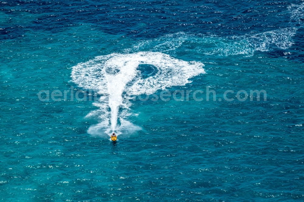 Ses Covetes from the bird's eye view: Jetski Sport boat ride near the coastal area Playa del Trench in Ses Covetes in Islas Baleares, Spain