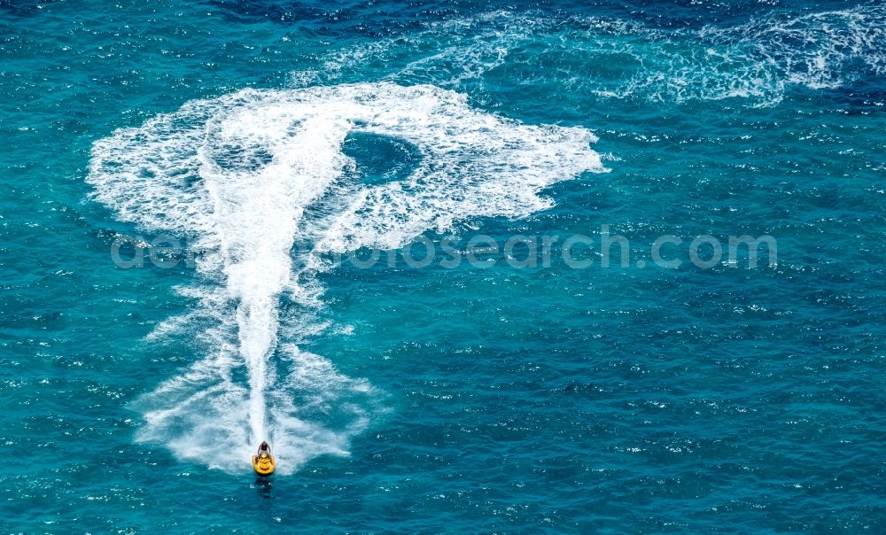 Aerial image Ses Covetes - Jetski Sport boat ride near the coastal area Playa del Trench in Ses Covetes in Islas Baleares, Spain