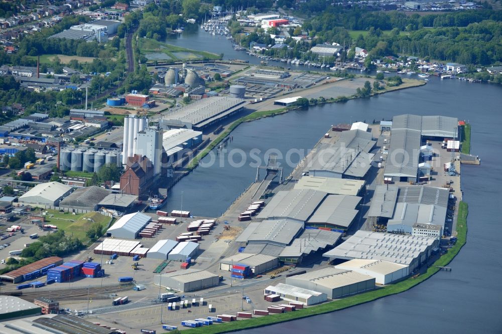 Lübeck from the bird's eye view: Wharves and piers with ship loading terminals in the inner harbor in Luebeck in the state Schleswig-Holstein