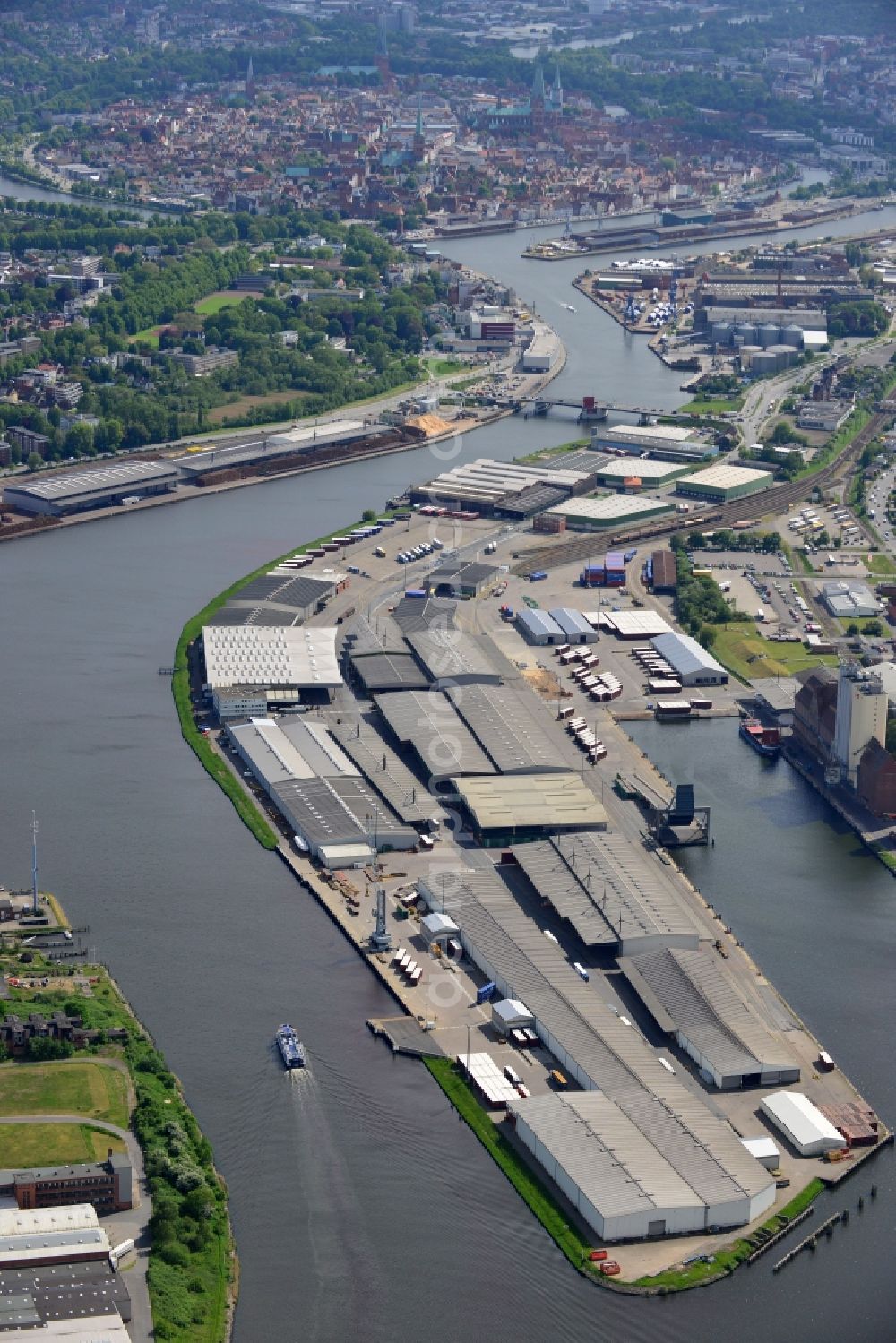 Lübeck from the bird's eye view: Wharves and piers with ship loading terminals in the inner harbor in Luebeck in the state Schleswig-Holstein