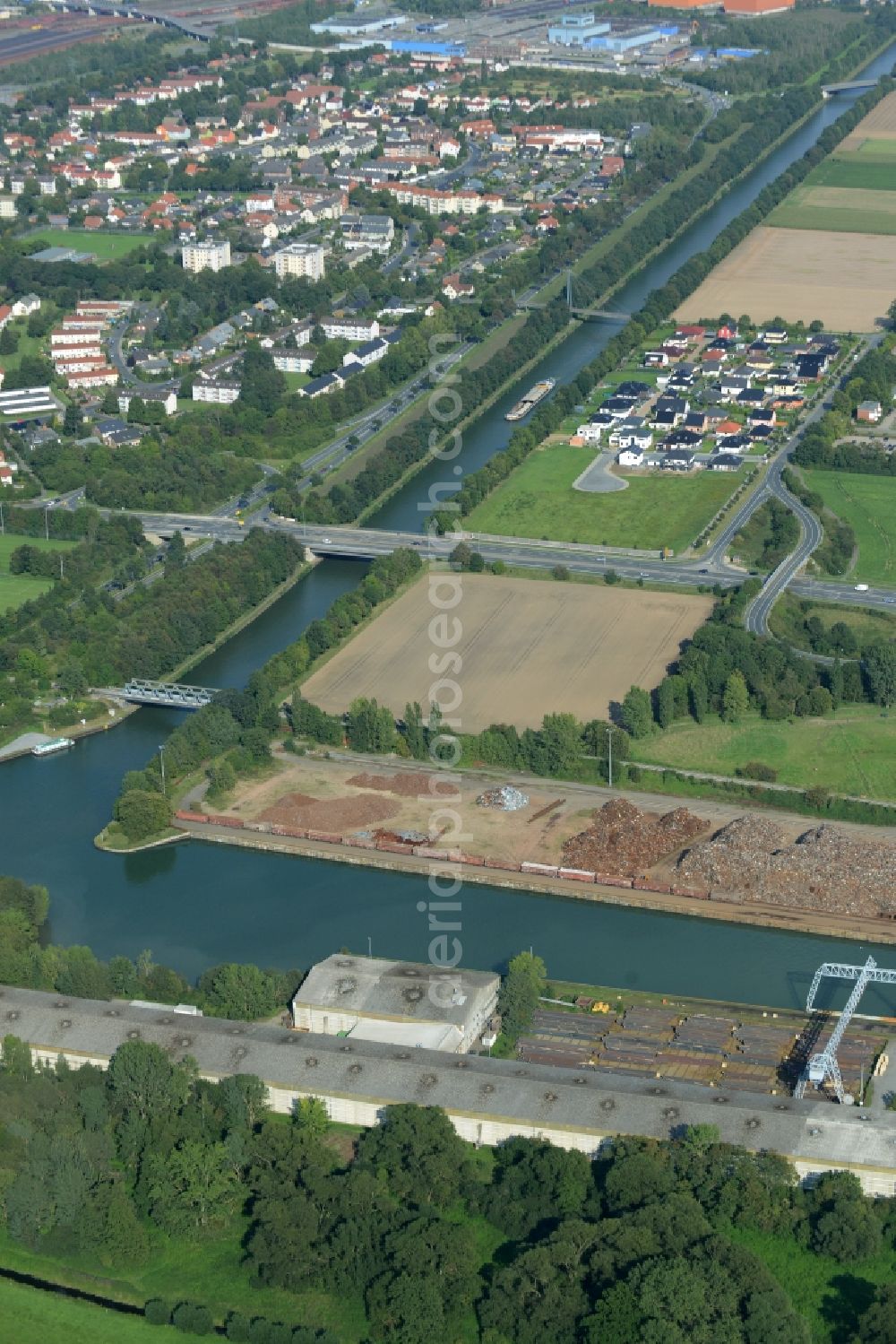 Peine from above - Wharves and piers with ship loading terminals in the inner harbor of Mittellandkanal in Peine in the state Lower Saxony