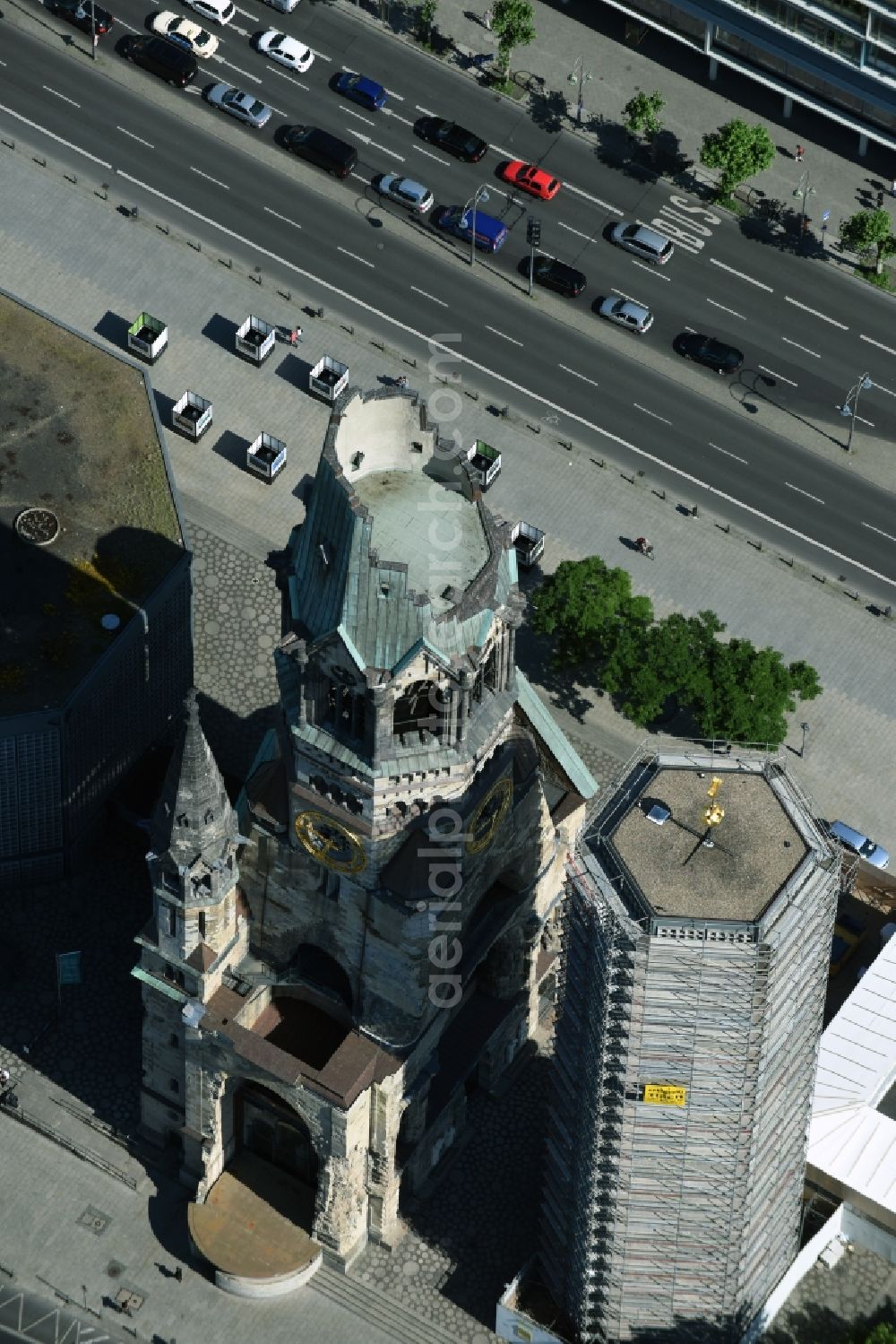 Berlin from the bird's eye view: The Protestant Kaiser William Memorial Church, commonly short memorial church stands on the Breitscheidplatz between the Kurfuerstendamm, the Tauentzienstrasse and the Budapest street in Berlin's Charlottenburg district. The non-damaged part of the old church is now a museum and war memorial