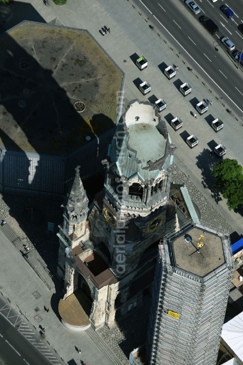 Aerial photograph Berlin - The Protestant Kaiser William Memorial Church, commonly short memorial church stands on the Breitscheidplatz between the Kurfuerstendamm, the Tauentzienstrasse and the Budapest street in Berlin's Charlottenburg district. The non-damaged part of the old church is now a museum and war memorial