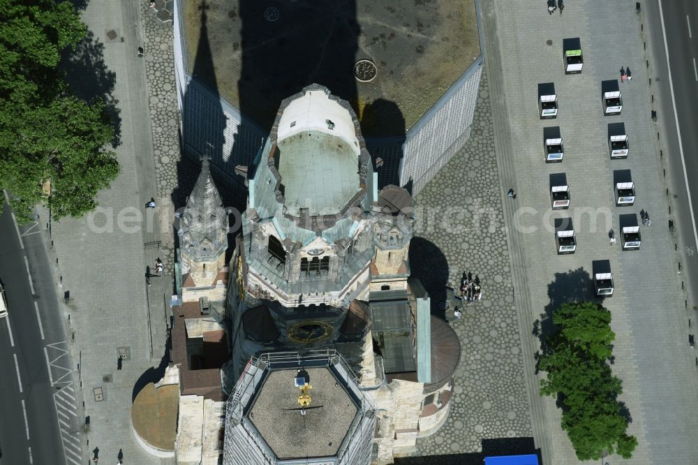 Berlin from the bird's eye view: The Protestant Kaiser William Memorial Church, commonly short memorial church stands on the Breitscheidplatz between the Kurfuerstendamm, the Tauentzienstrasse and the Budapest street in Berlin's Charlottenburg district. The non-damaged part of the old church is now a museum and war memorial