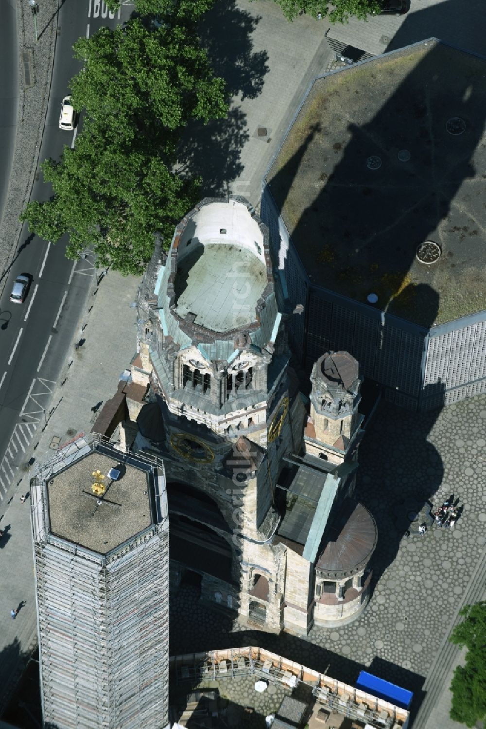 Berlin from above - The Protestant Kaiser William Memorial Church, commonly short memorial church stands on the Breitscheidplatz between the Kurfuerstendamm, the Tauentzienstrasse and the Budapest street in Berlin's Charlottenburg district. The non-damaged part of the old church is now a museum and war memorial