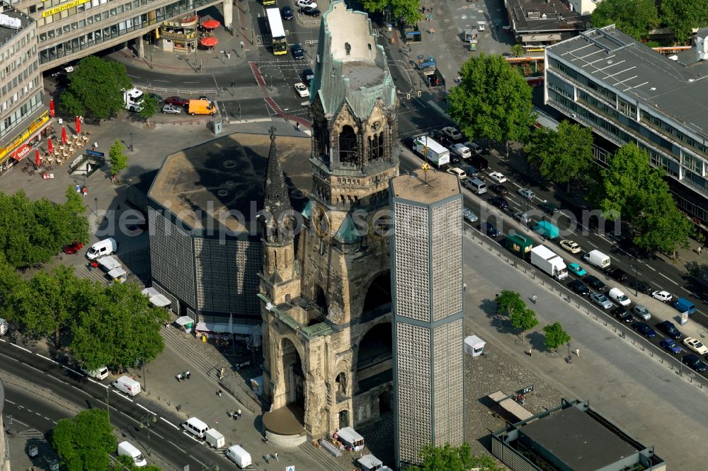 Aerial photograph Berlin - The Protestant Kaiser William Memorial Church, commonly short memorial church stands on the Breitscheidplatz between the Kurfuerstendamm, the Tauentzienstrasse and the Budapest street in Berlin's Charlottenburg district. The non-damaged part of the old church is now a museum and war memorial