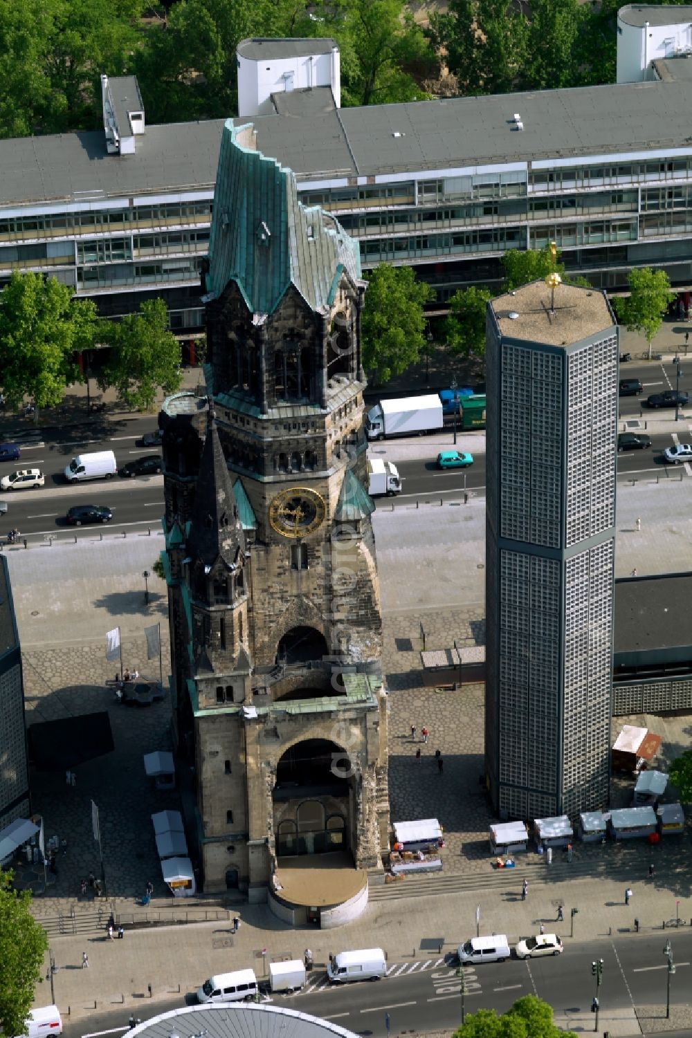 Berlin from the bird's eye view: The Protestant Kaiser William Memorial Church, commonly short memorial church stands on the Breitscheidplatz between the Kurfuerstendamm, the Tauentzienstrasse and the Budapest street in Berlin's Charlottenburg district. The non-damaged part of the old church is now a museum and war memorial