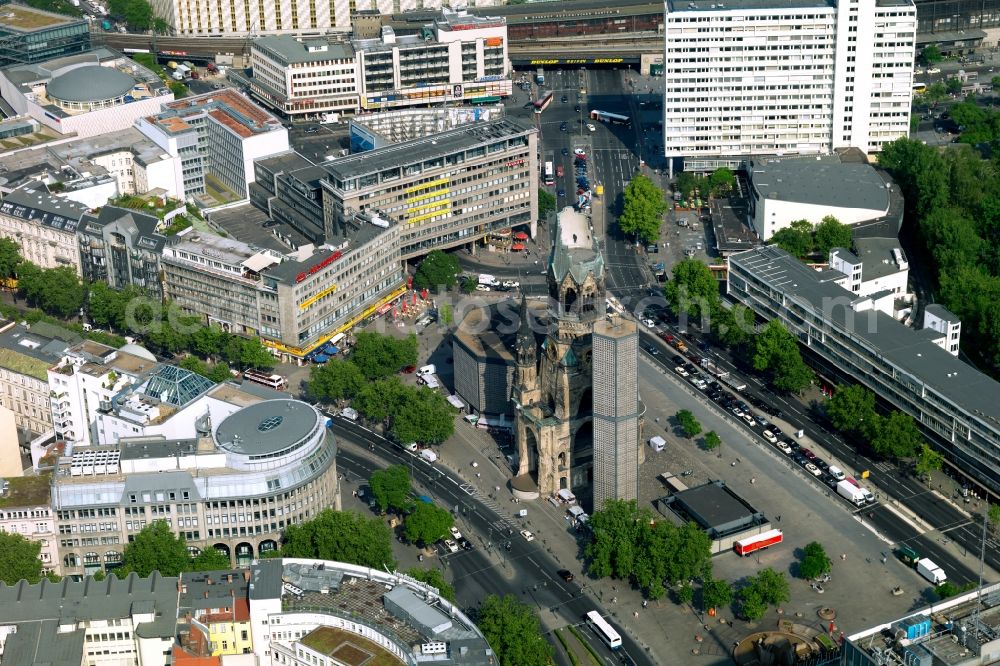 Aerial photograph Berlin - The Protestant Kaiser William Memorial Church, commonly short memorial church stands on the Breitscheidplatz between the Kurfuerstendamm, the Tauentzienstrasse and the Budapest street in Berlin's Charlottenburg district. The non-damaged part of the old church is now a museum and war memorial