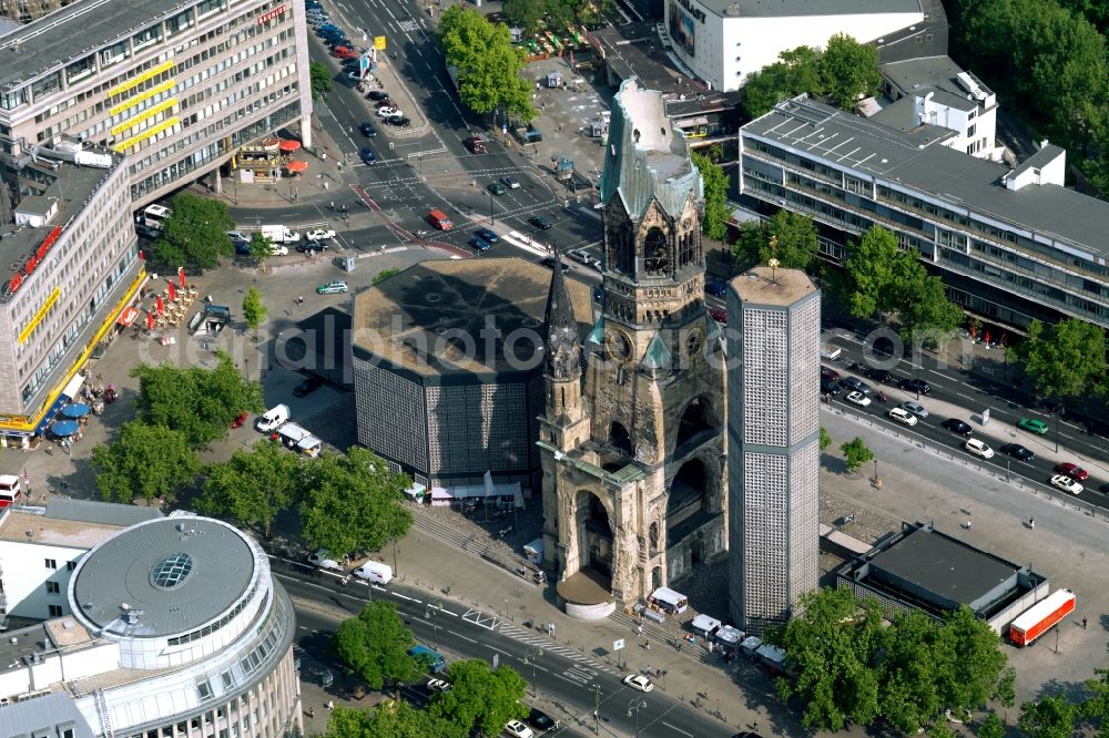 Berlin from above - The Protestant Kaiser William Memorial Church, commonly short memorial church stands on the Breitscheidplatz between the Kurfuerstendamm, the Tauentzienstrasse and the Budapest street in Berlin's Charlottenburg district. The non-damaged part of the old church is now a museum and war memorial