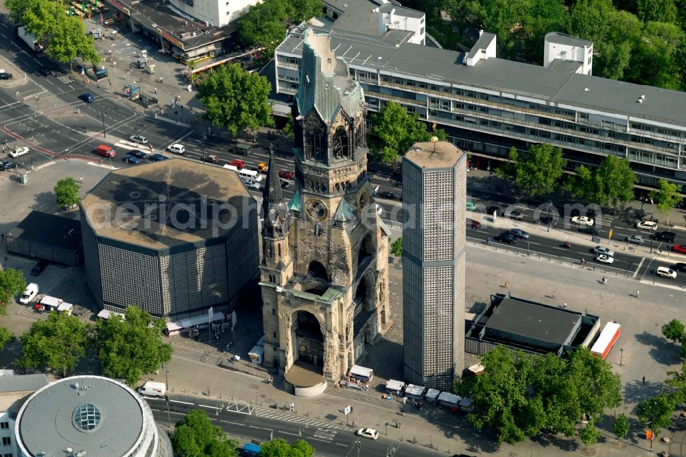 Berlin from the bird's eye view: The Protestant Kaiser William Memorial Church, commonly short memorial church stands on the Breitscheidplatz between the Kurfuerstendamm, the Tauentzienstrasse and the Budapest street in Berlin's Charlottenburg district. The non-damaged part of the old church is now a museum and war memorial