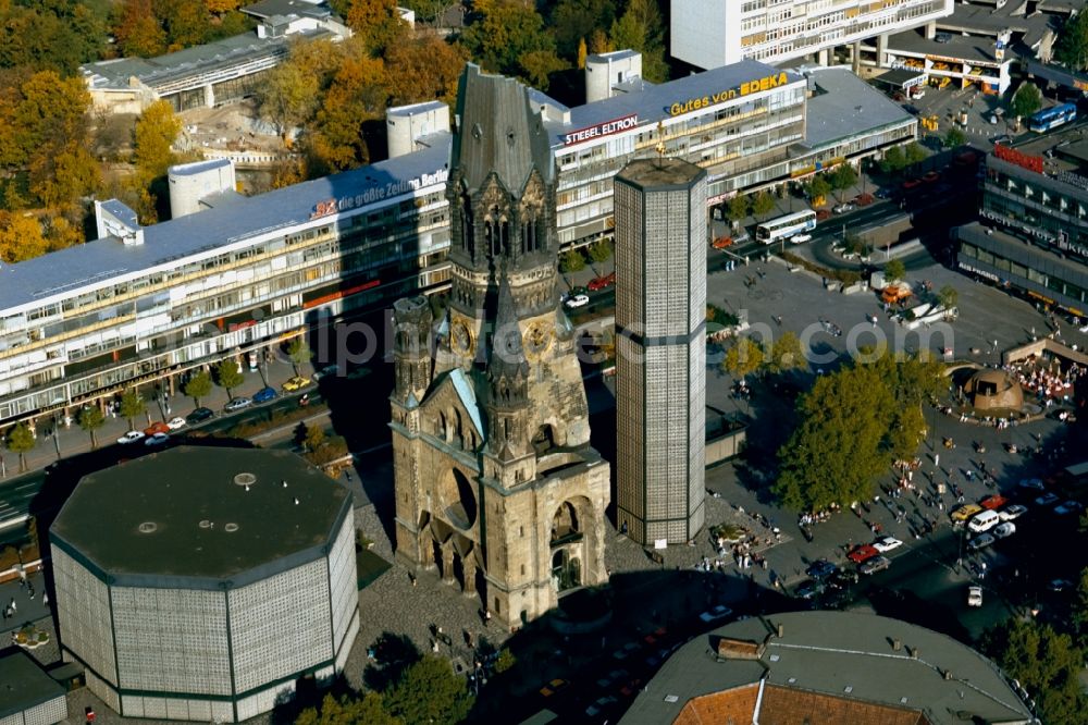 Berlin from above - The Protestant Kaiser William Memorial Church, commonly short memorial church stands on the Breitscheidplatz between the Kurfuerstendamm, the Tauentzienstrasse and the Budapest street in Berlin's Charlottenburg district. The non-damaged part of the old church is now a museum and war memorial